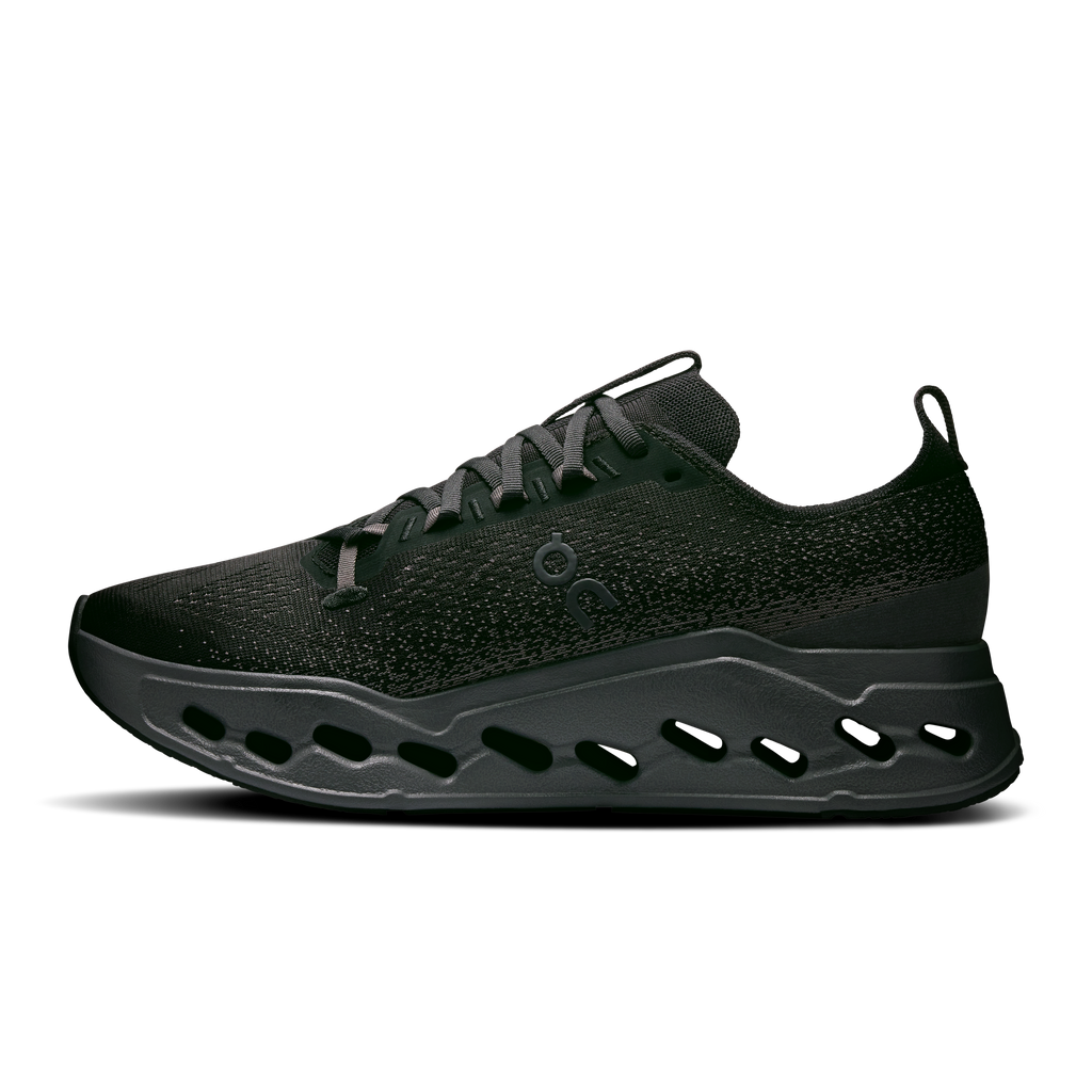 Wide running sneakers with speckled dark upper, lace-up front, and pod midsole