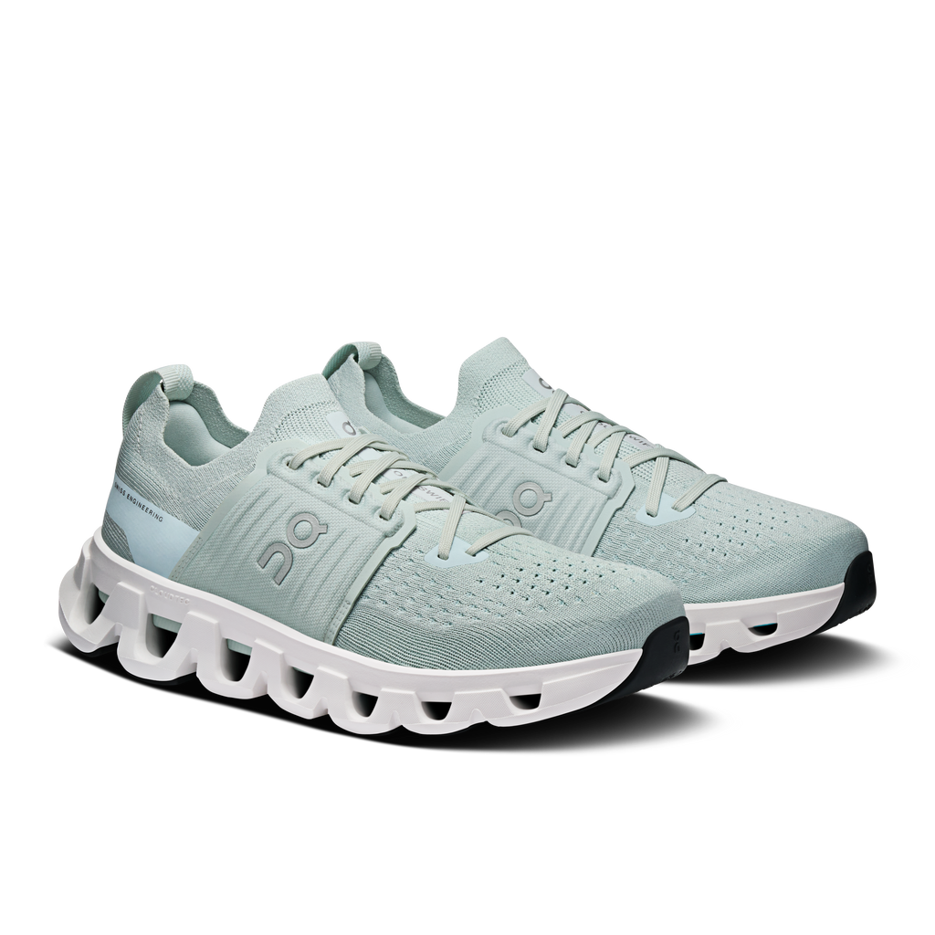 Pair of light blue lace-up running shoes with white CloudTec cushioning pods