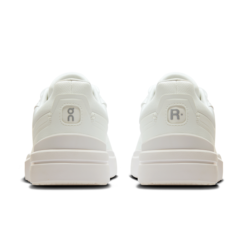 Back view of white lace-up sneakers with heel tabs and cushioned midsole