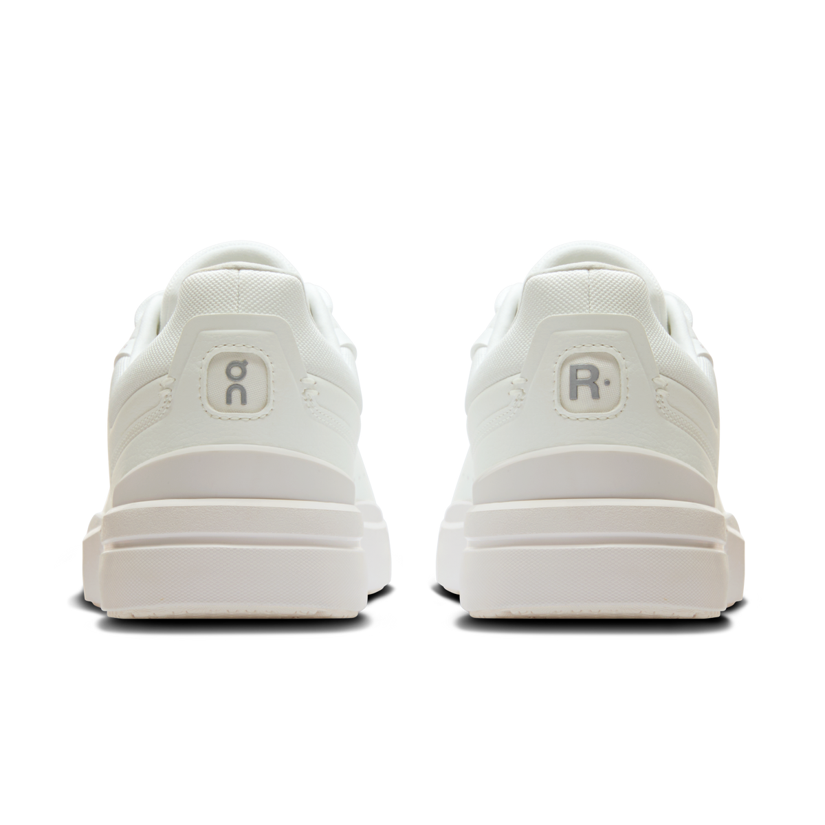 Back view of white lace-up sneakers with heel tabs and cushioned midsole