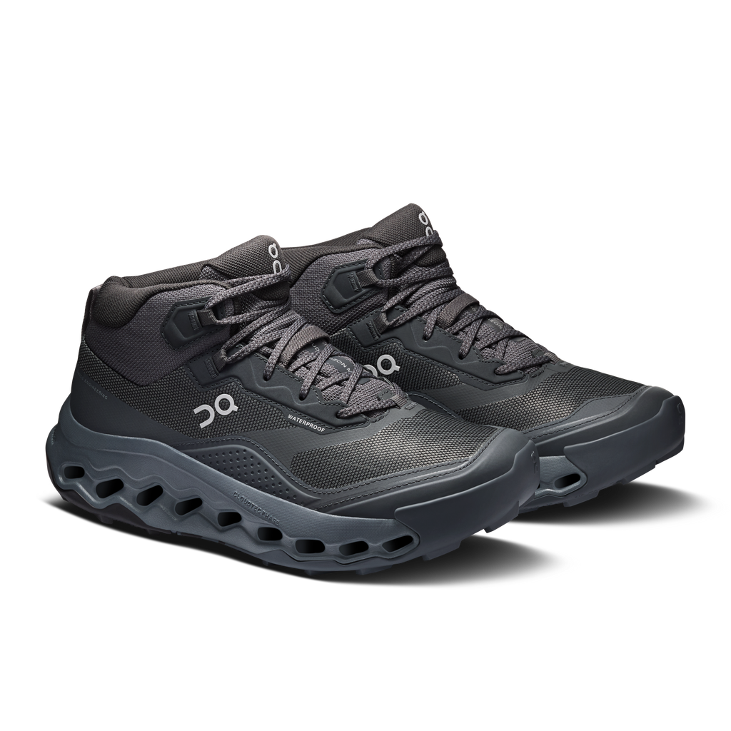 Women's mid waterproof trail running shoes by On, dark gray with chunky cloud sole