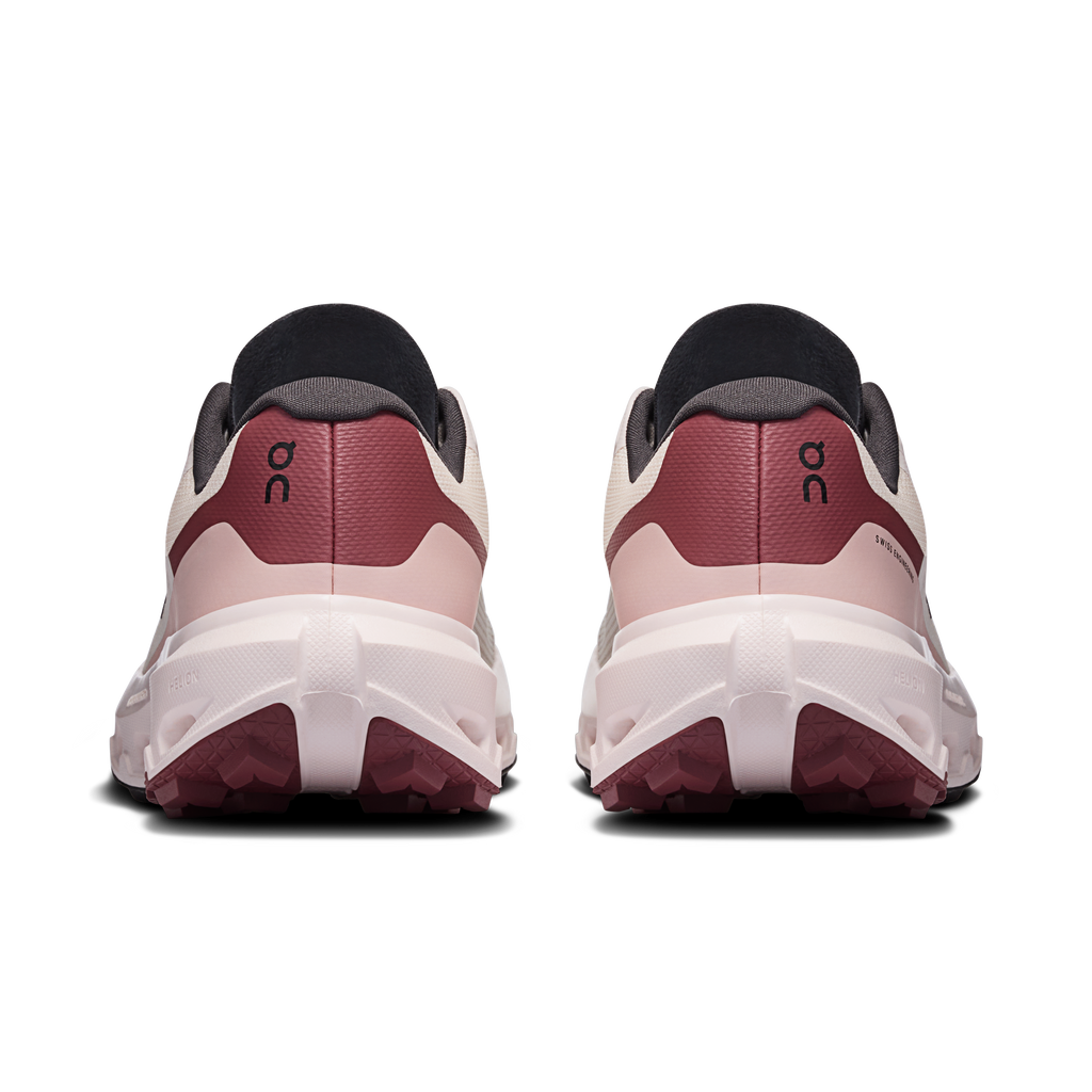 Women's running shoes heel view, maroon rear panel, dark collar, and cushioned white sole.