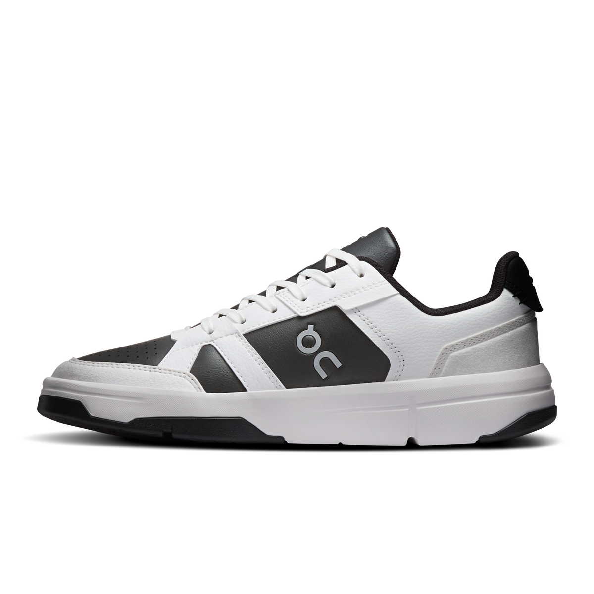 White lace-up sneaker with dark On panel, perforated toe, and chunky sole