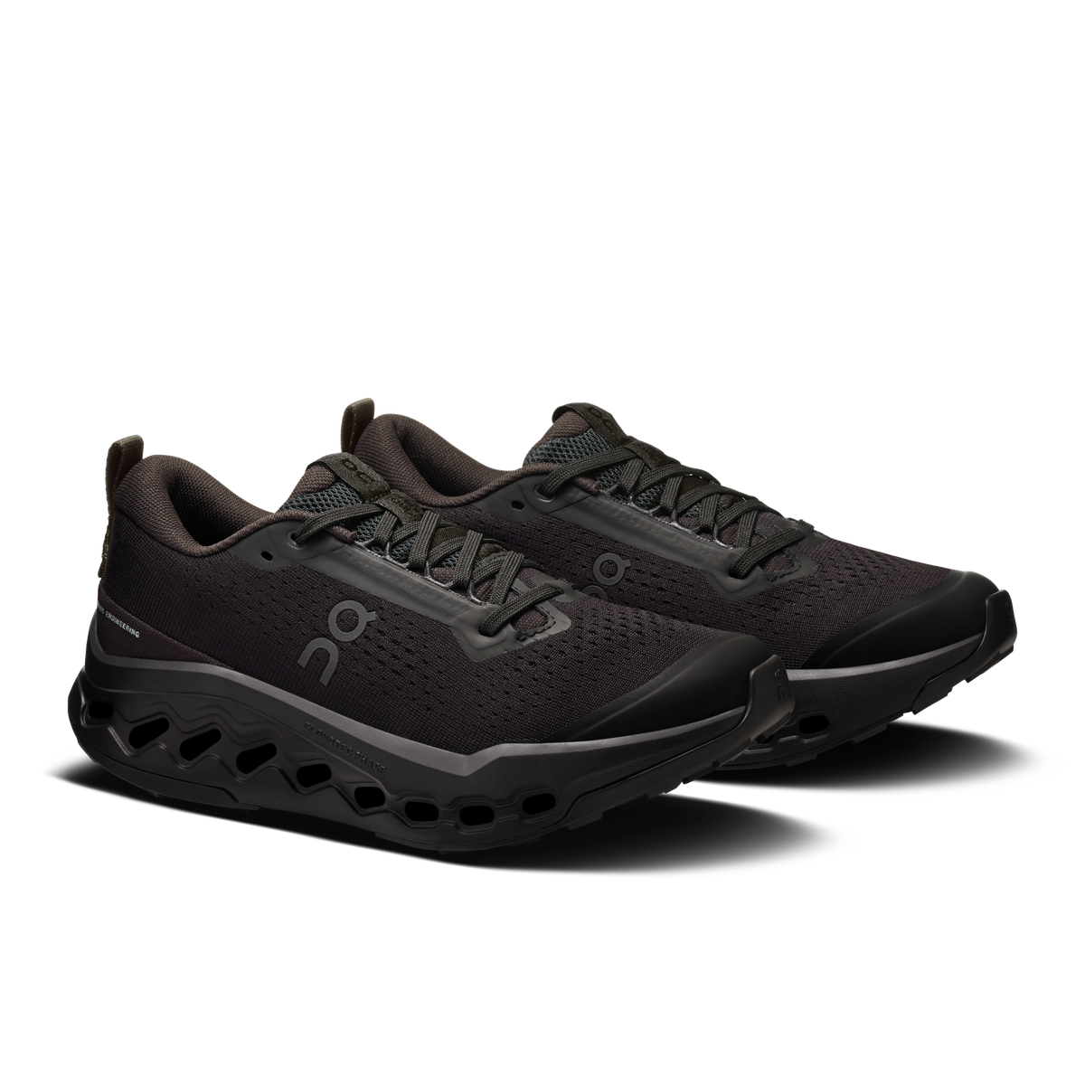 Women’s black trail running shoes, side view with lace-up mesh upper and outsole pods
