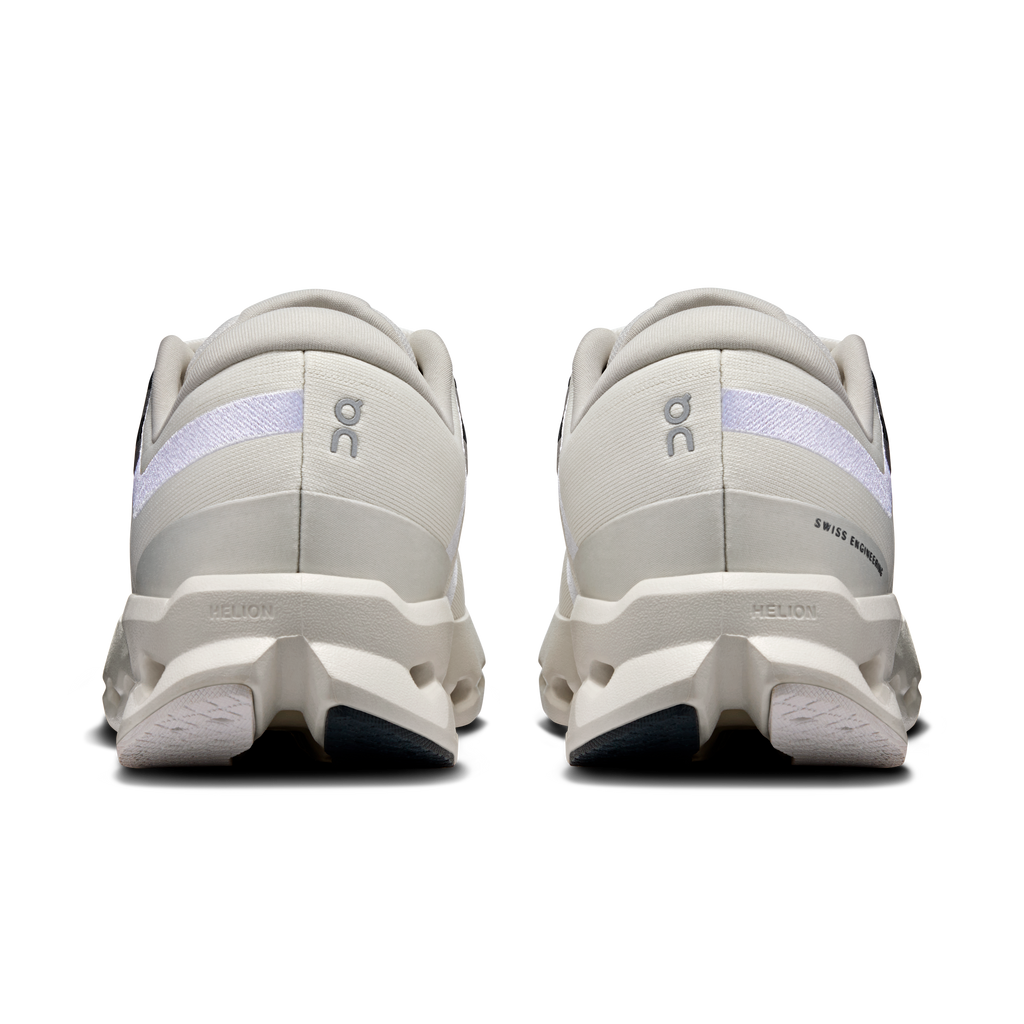 Back view of ivory running shoes with heel branding and cushioned sole