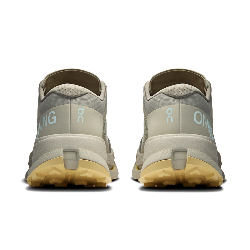 Men's running shoes heel view with padded collar, logo details, light gum outsole