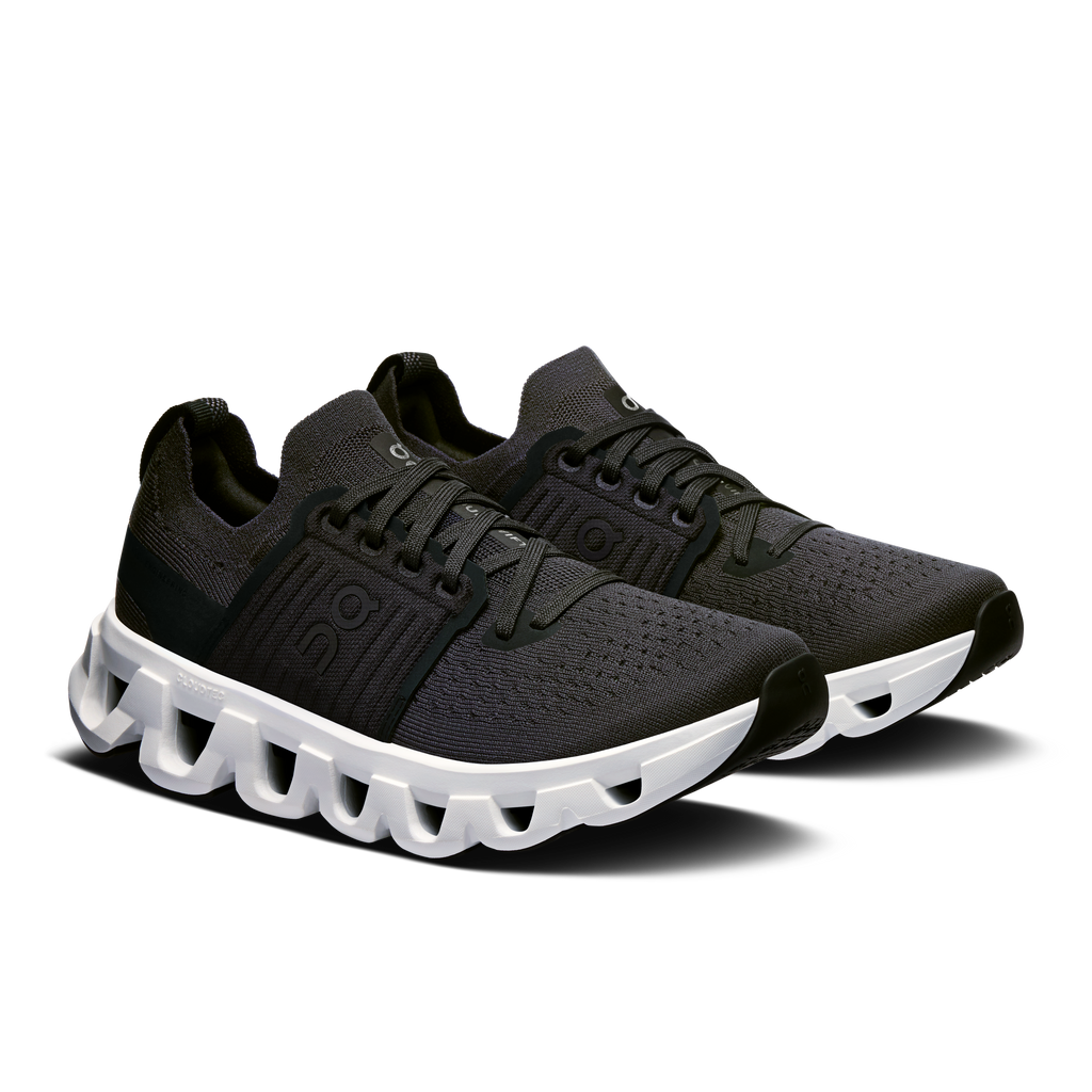 Women's running shoes, black lace-up upper and white Cloud-style cushioning sole