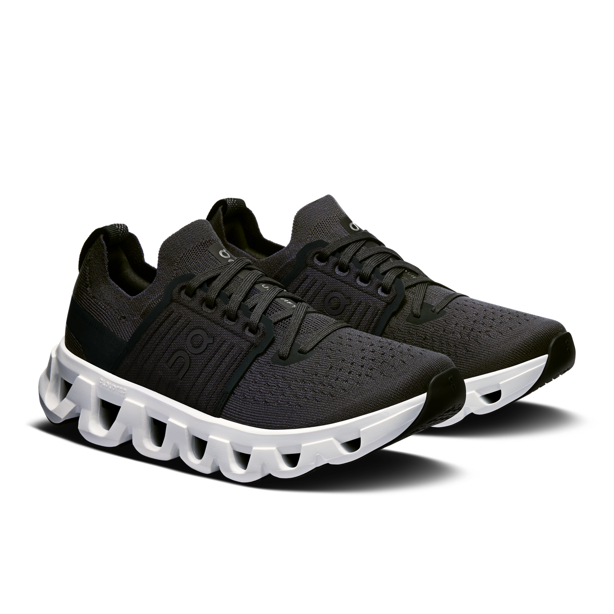 Women's running shoes, black lace-up upper and white Cloud-style cushioning sole