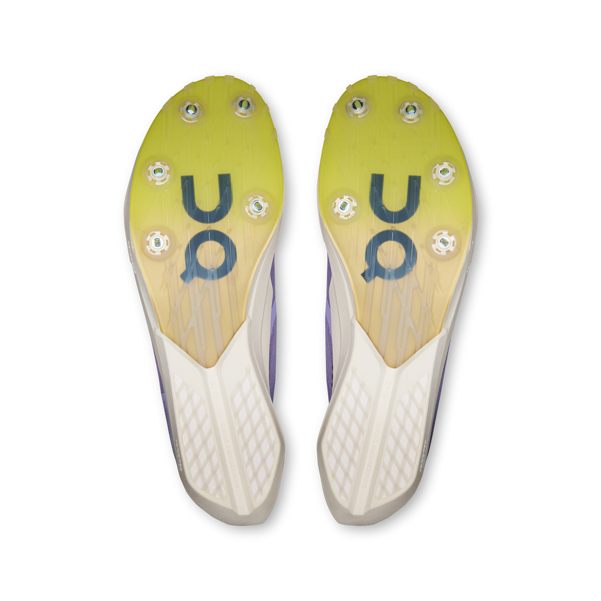 Pair of shoe outsoles in yellow with grip studs and On logo markings