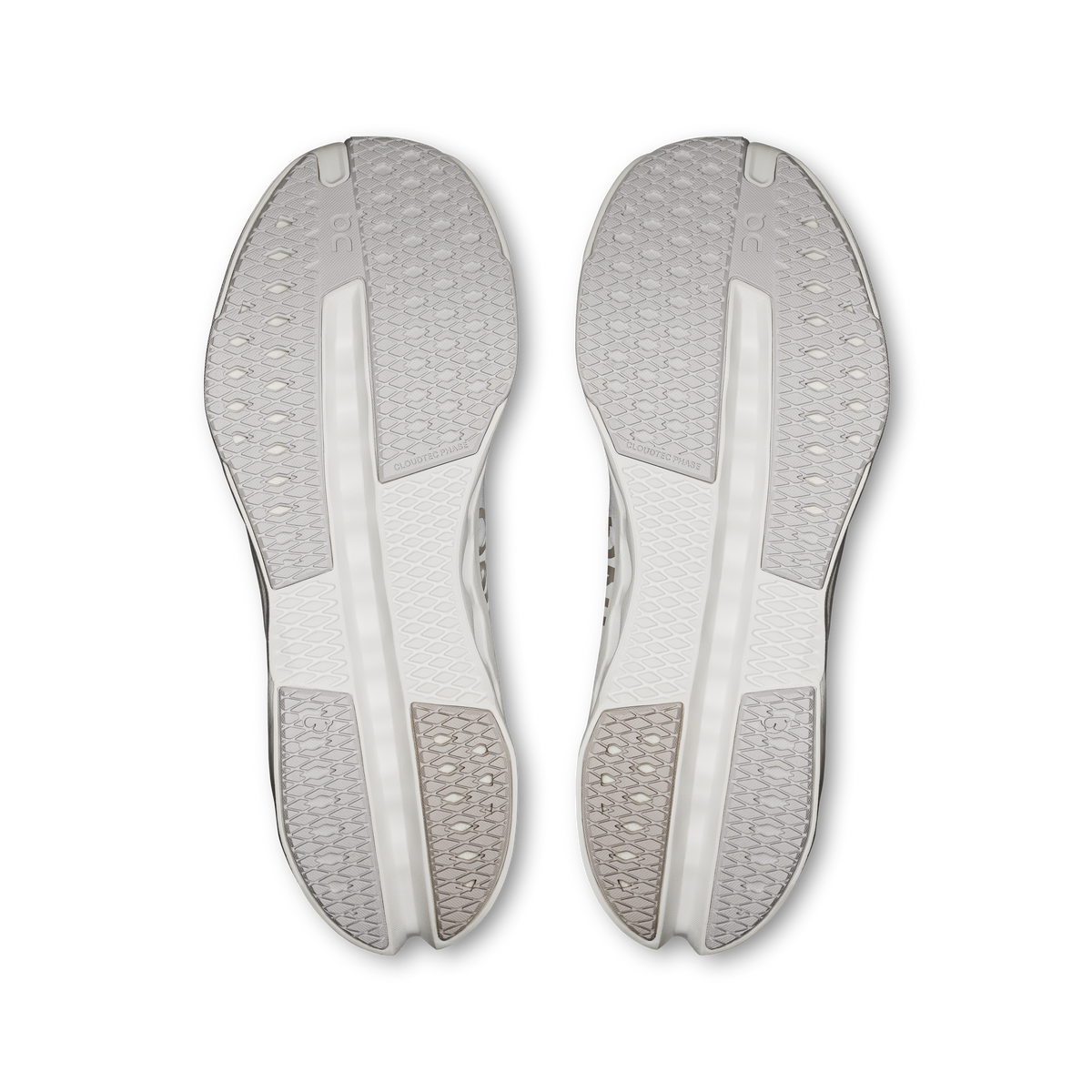 On Cloudsurfer Next men's running shoes, pair of white soles with traction channels