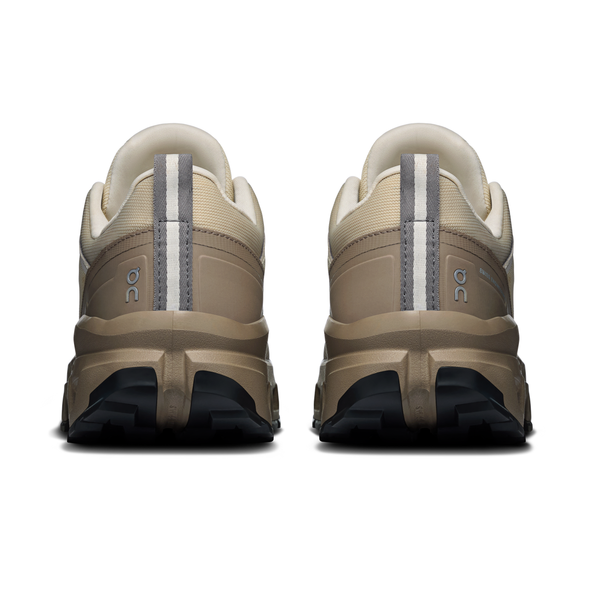 Women's waterproof low-top shoes, rear view with cream uppers and dark heel tread