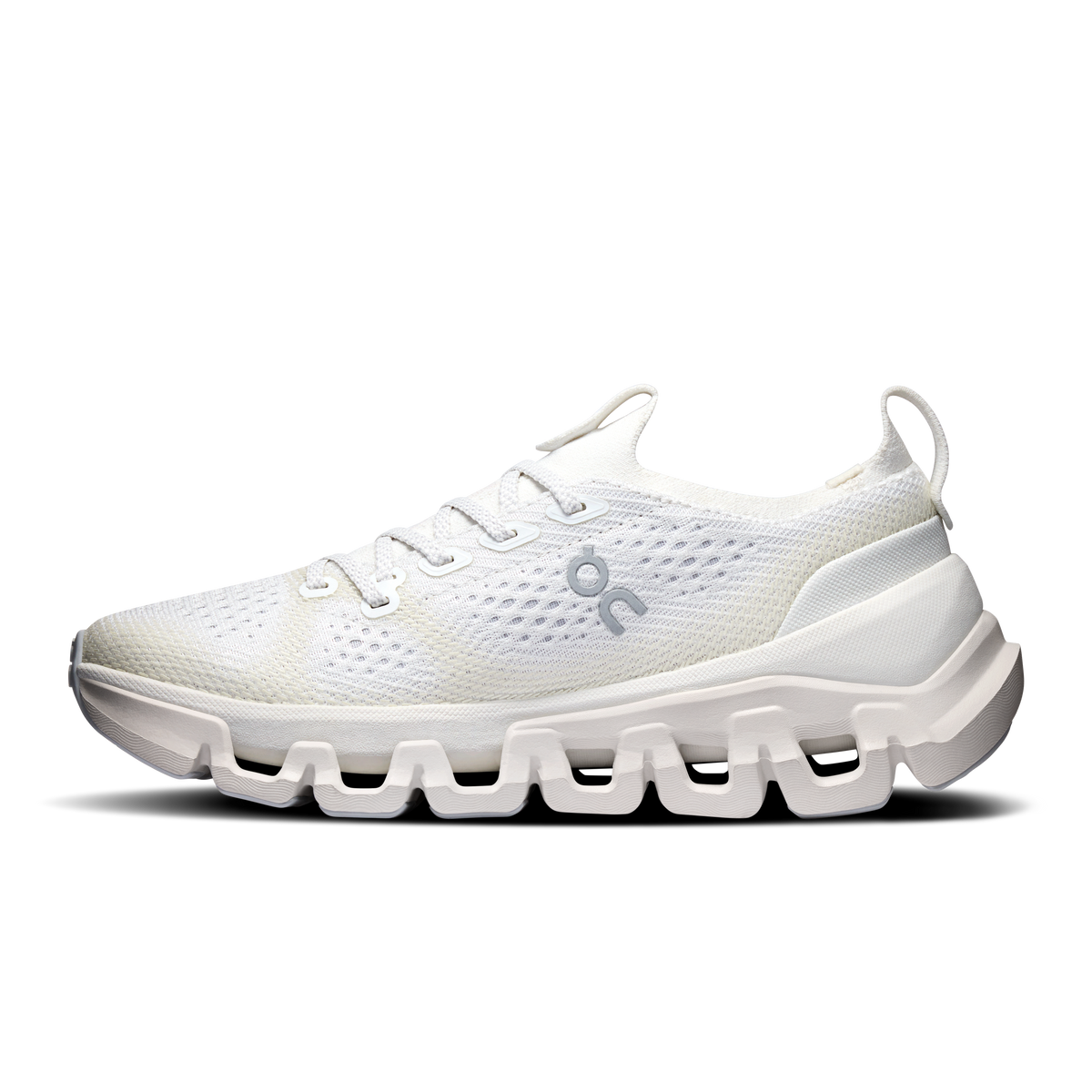Women's ivory running shoes, angled side view with thick cushioned midsole