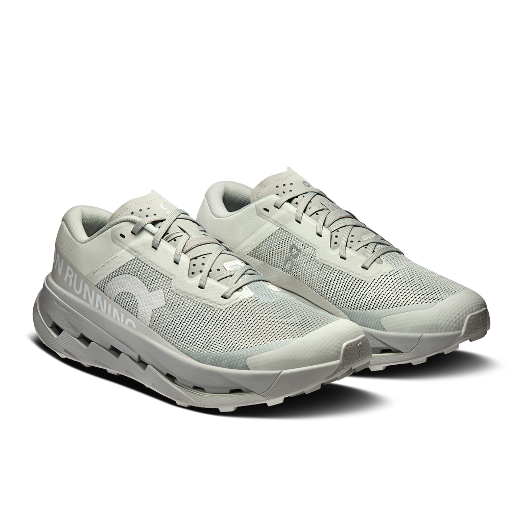 Men's running shoes pair, light blue-gray mesh upper with lace-up, chunky cushioned sole