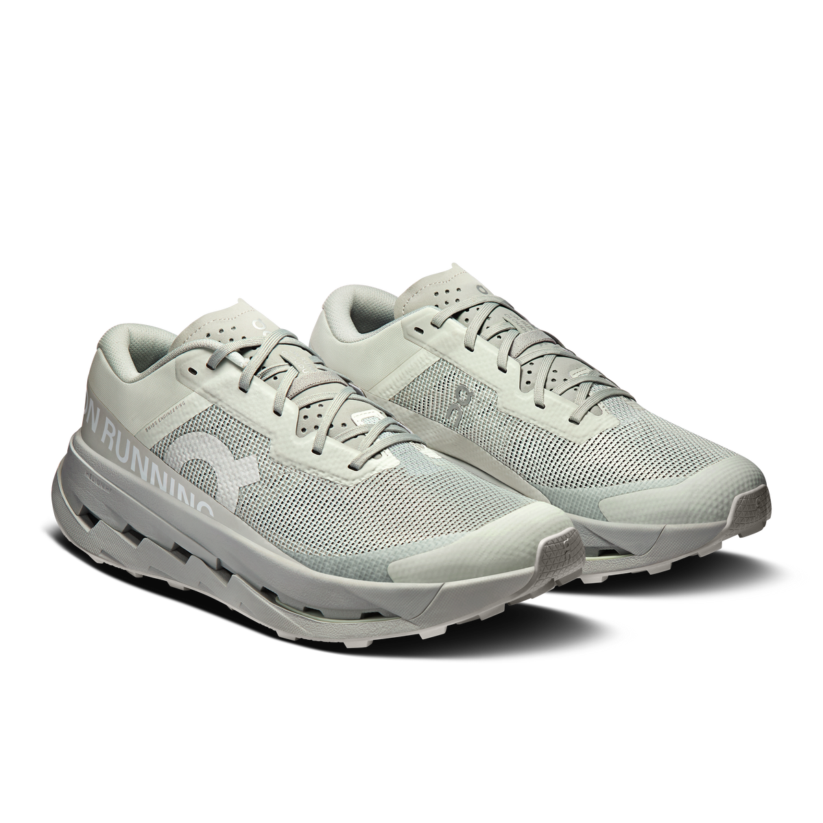Men's running shoes pair, light blue-gray mesh upper with lace-up, chunky cushioned sole
