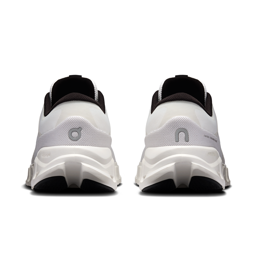 Rear view of men's white running shoes with black collar and heel padding