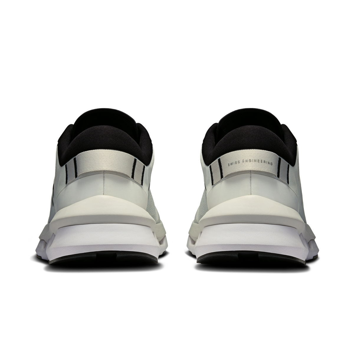 Heel view of white running shoes with black collar and strap