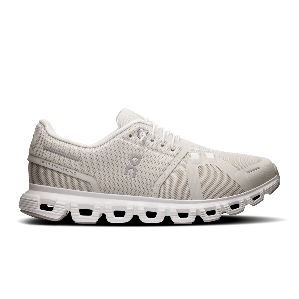 Women's running shoes in pearl and white, lace-up mesh with CloudTec sole.