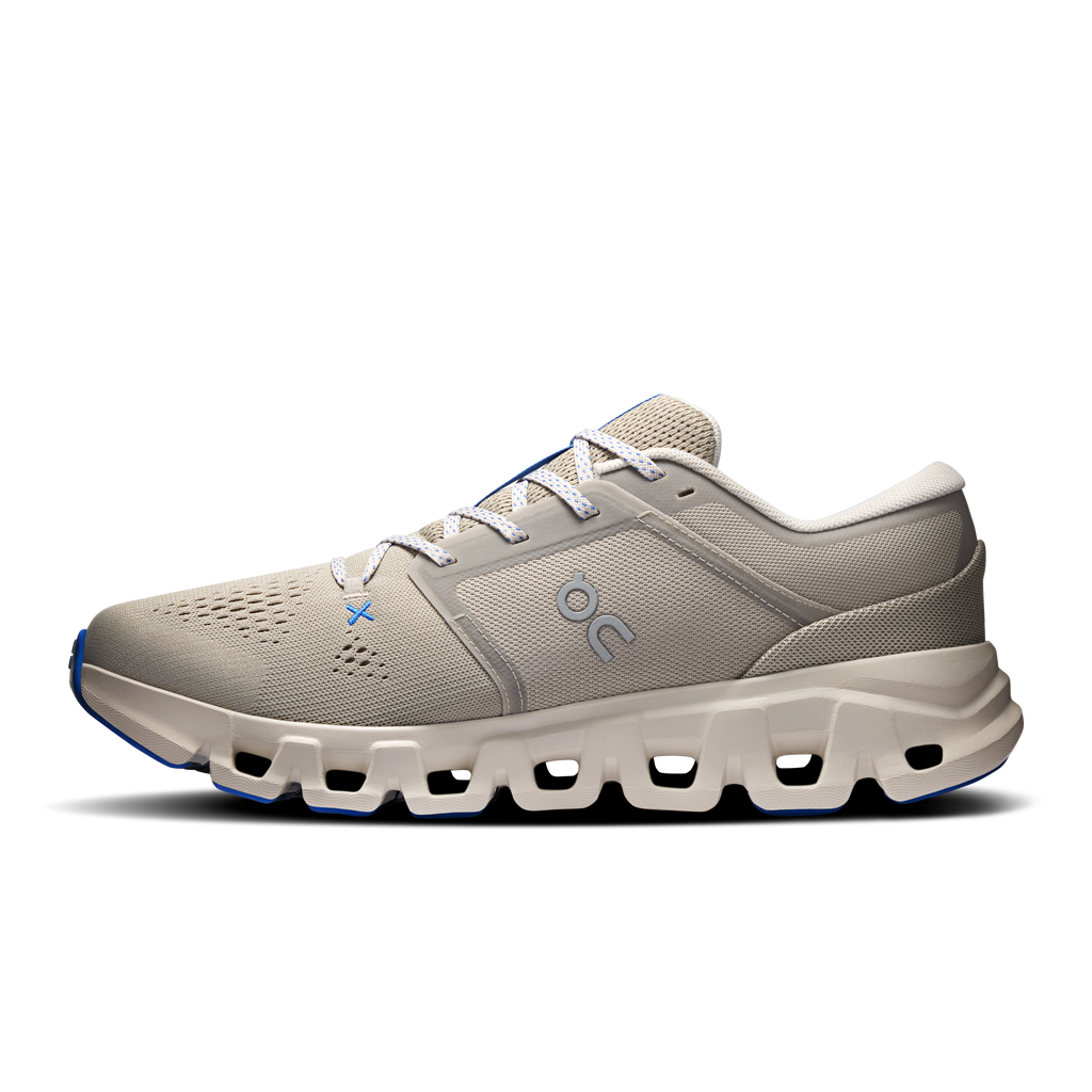 Men's running shoes, light gray mesh upper with blue lace tips and thick sole