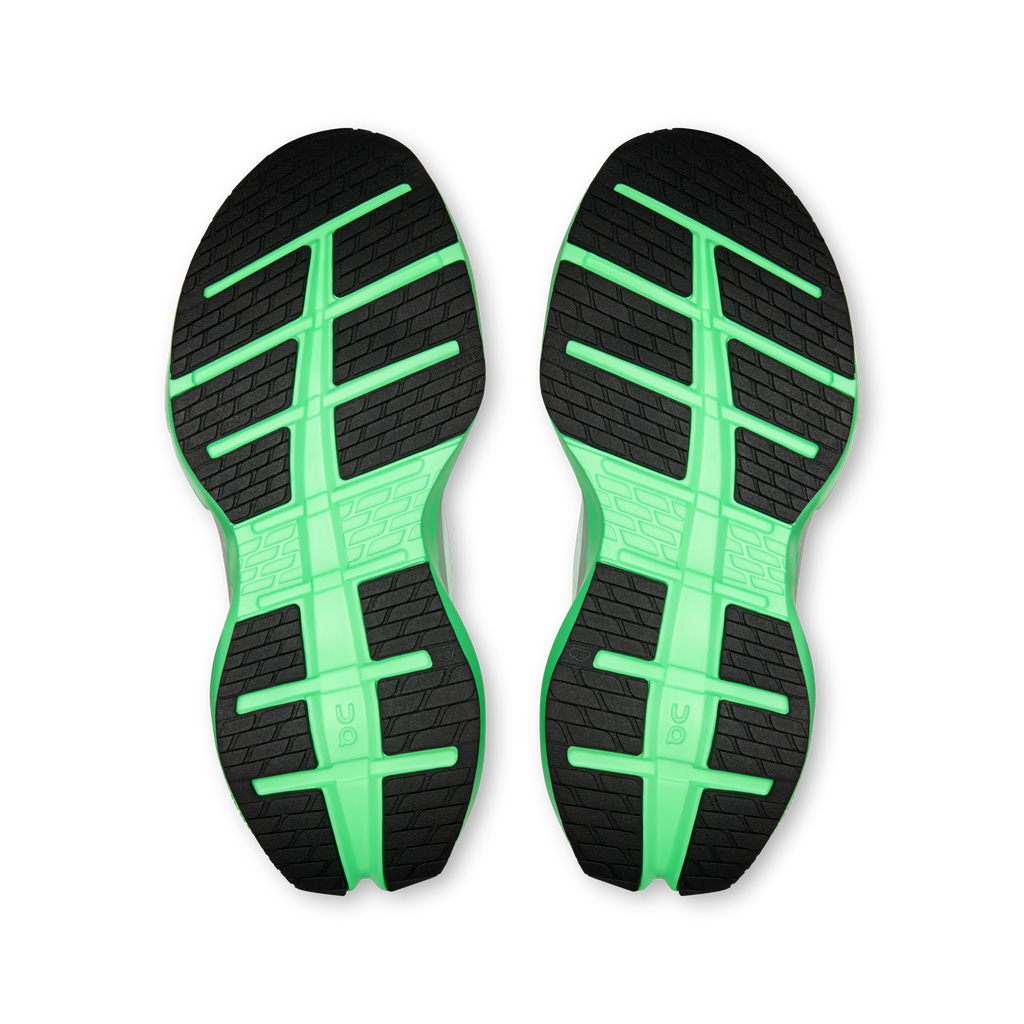 Shoe outsoles, black tread with bright mint-green grid channels