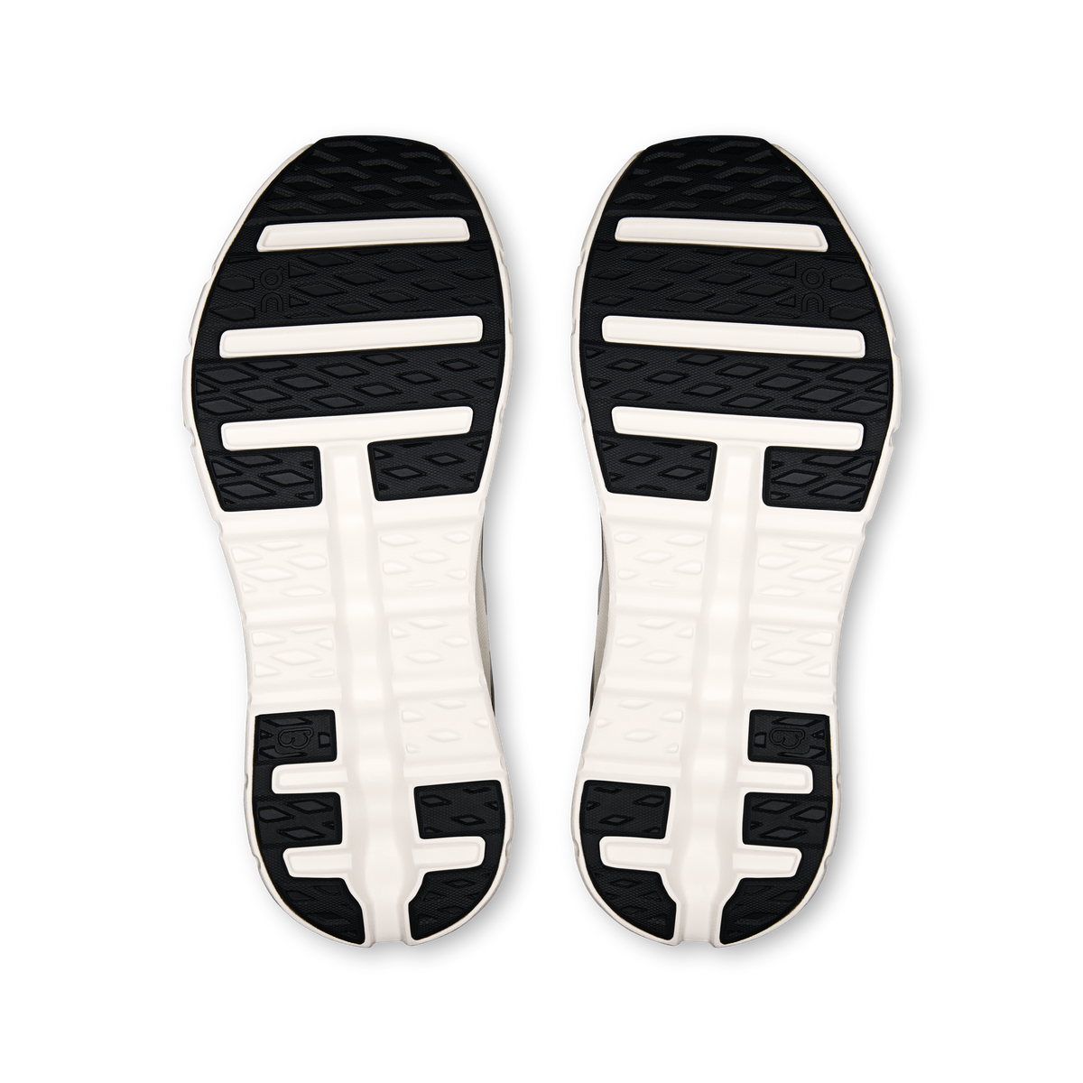 Shoe outsole pair with textured grip tread in black and white; traction bar details