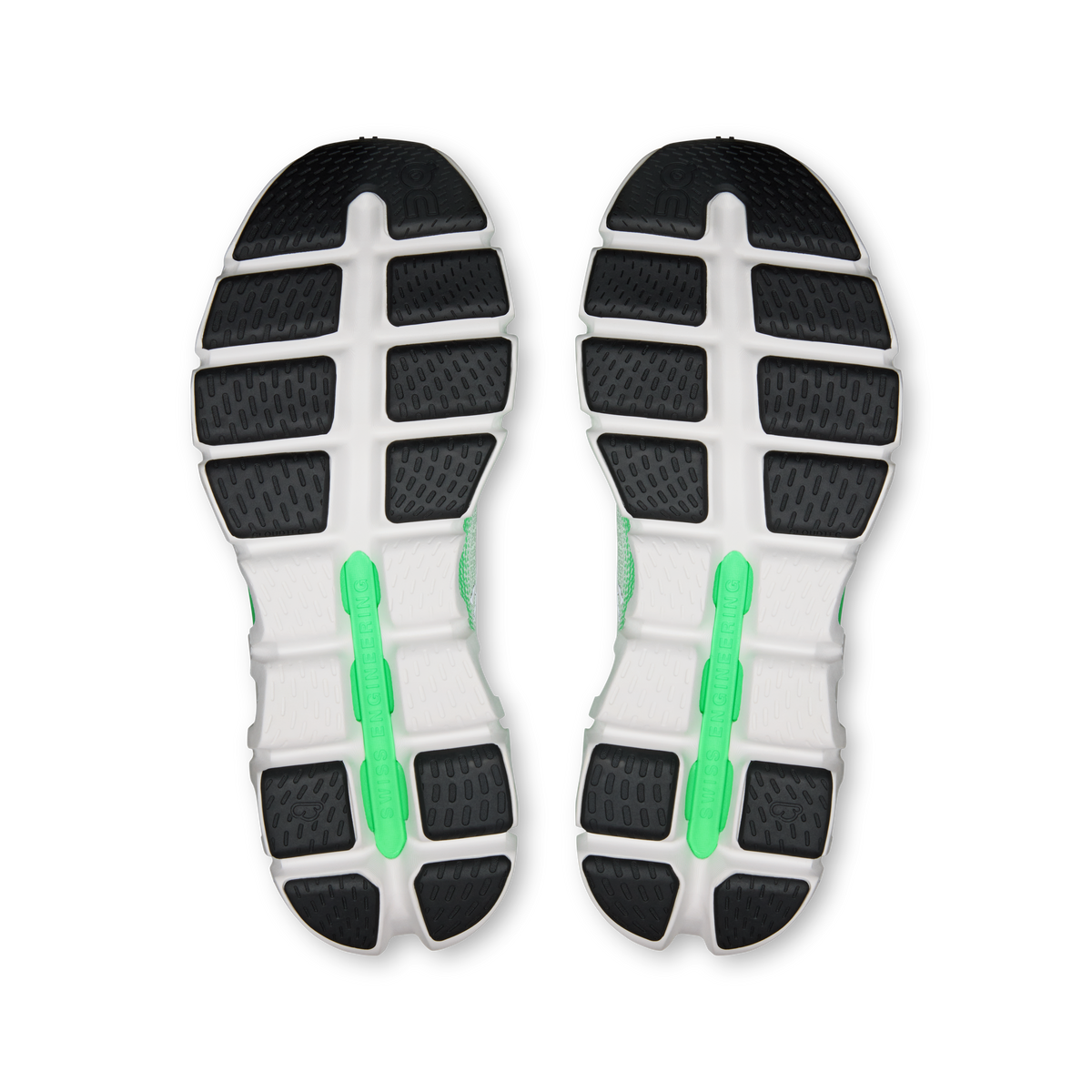Men's running shoe outsole view with patterned rubber and green inserts