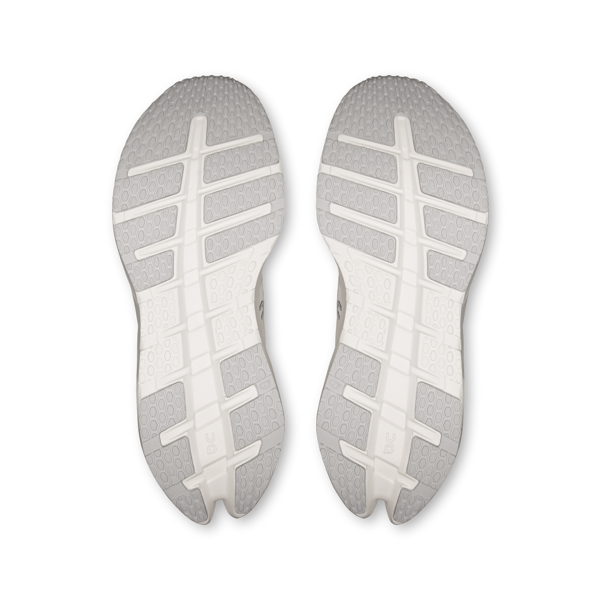 Men's wide running shoes outsoles with textured tread pattern in white.