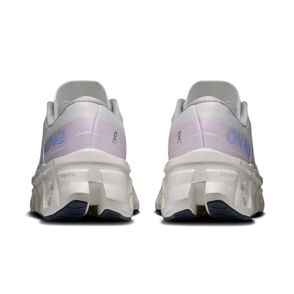 Women's wide running shoes, back view with cushioned heel and On logo in dark blue