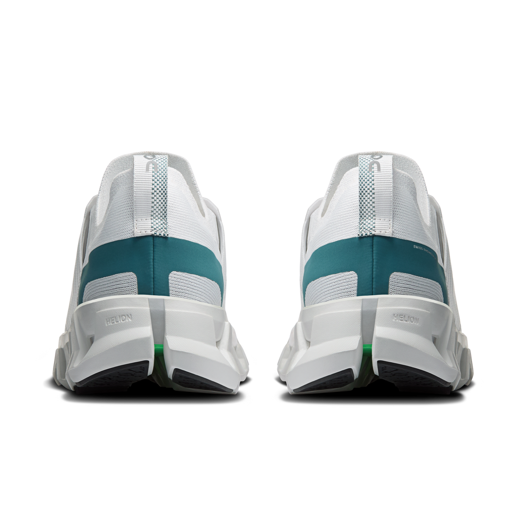 Men's white running shoes heel view with teal panels and cushioned rear sole