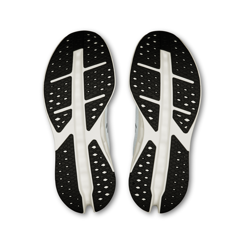 On shoe outsoles: black traction tread with white sidewall cushioning pods