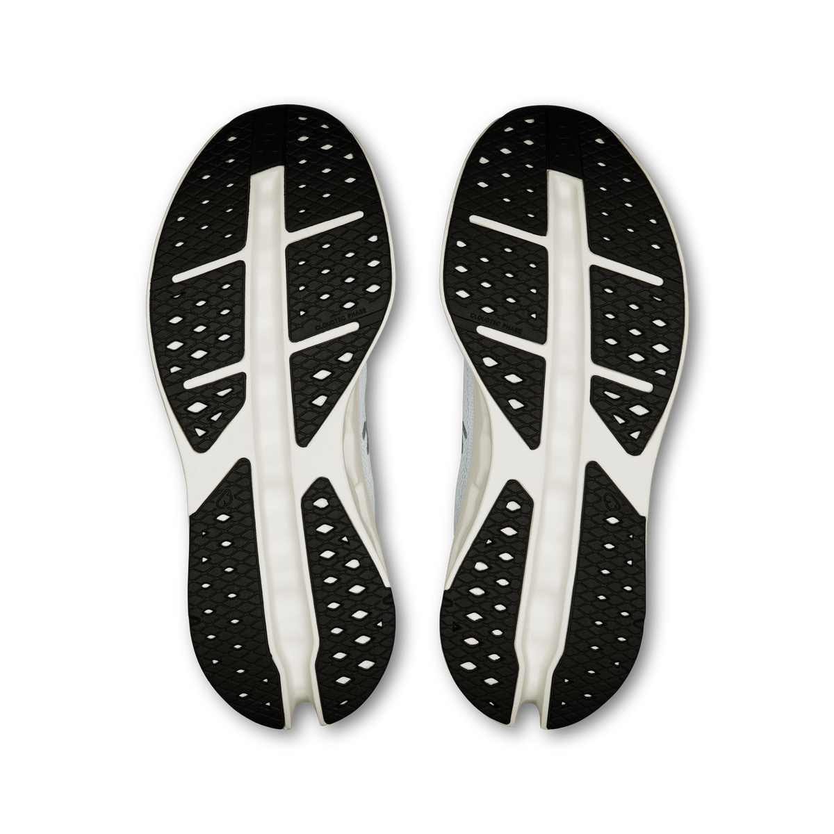 On shoe outsoles: black traction tread with white sidewall cushioning pods