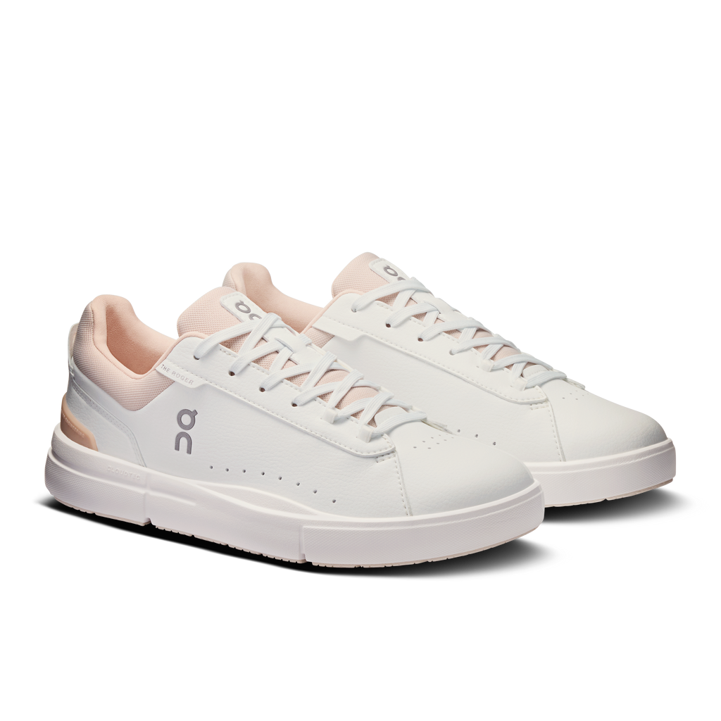 Women's On lace-up sneakers in white with rose accents, front three-quarter view