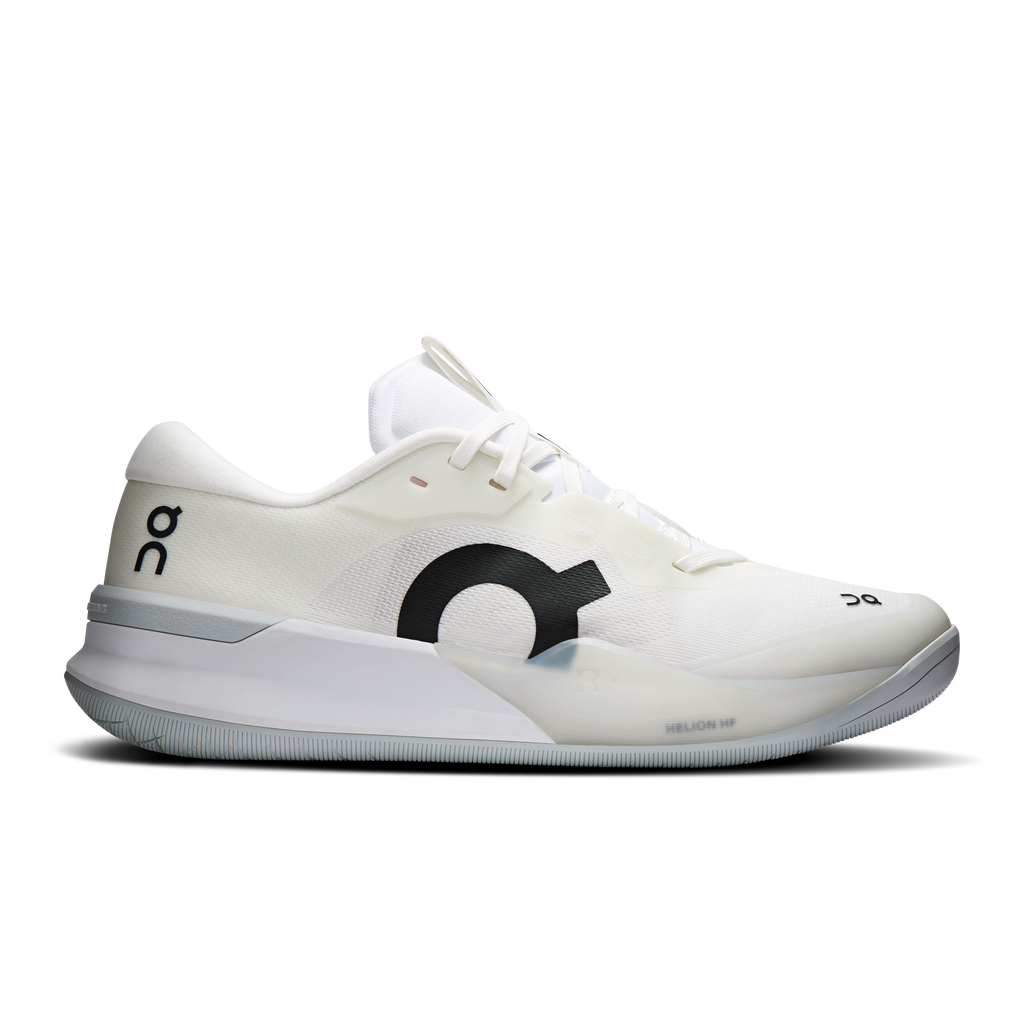 White women's running shoes with black logo, gray sole and subtle pink accents