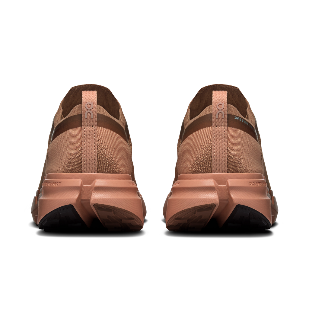 On men's running shoes, rear view, tan-brown uppers with padded collar and laces