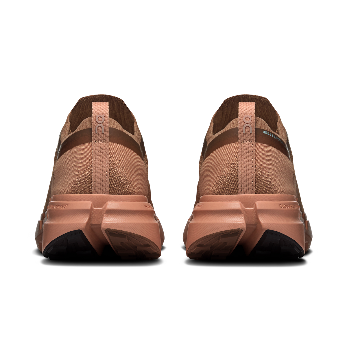 On men's running shoes, rear view, tan-brown uppers with padded collar and laces
