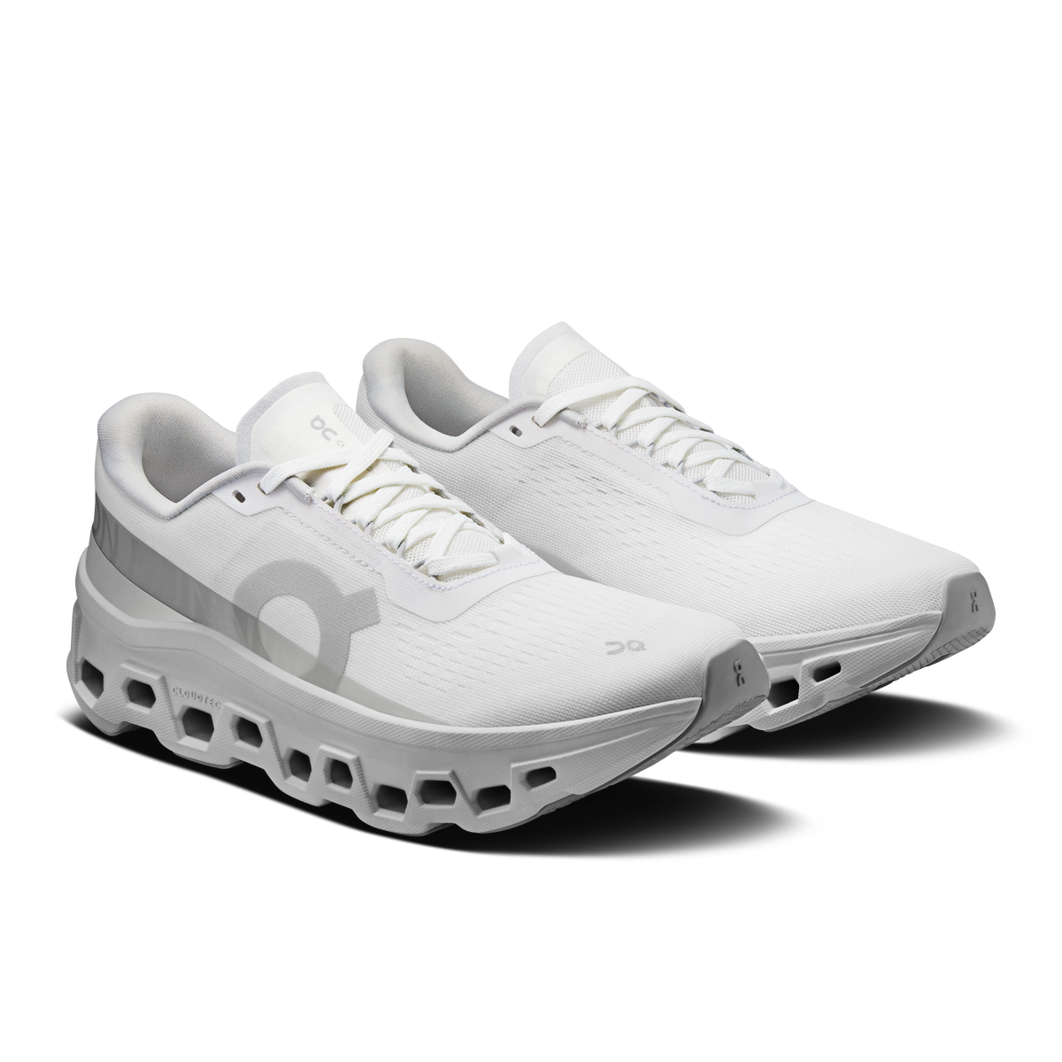 White women's running shoes, side view, lace-up mesh upper and CloudTec pods