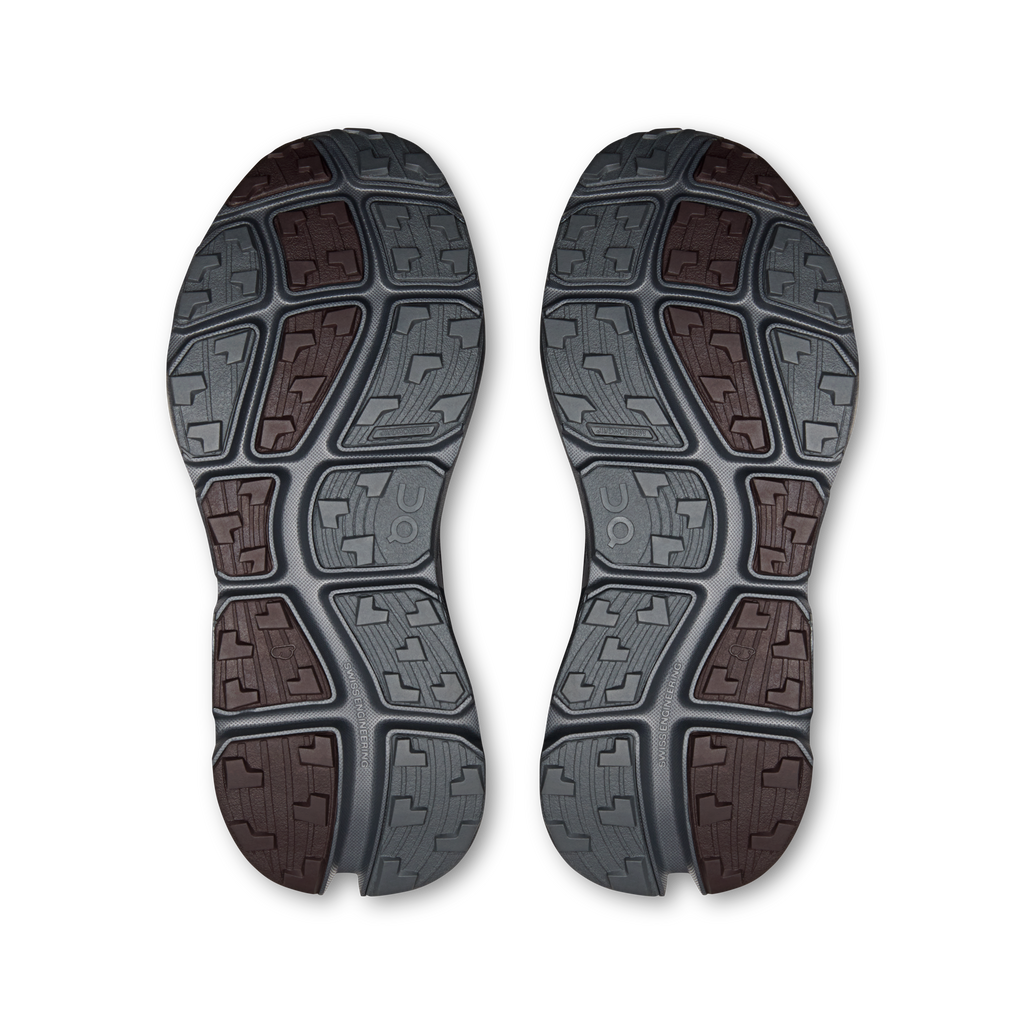 Shoe outsole tread pattern in gray with brown and maroon traction blocks