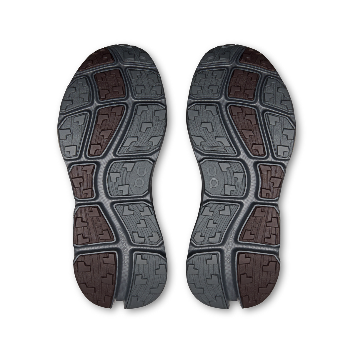 Shoe outsole tread pattern in gray with brown and maroon traction blocks
