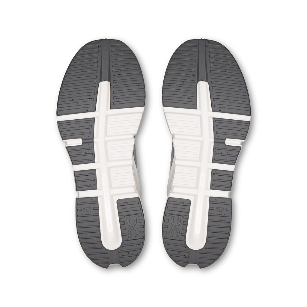 Shoe outsoles, dark gray rubber tread with white center spine