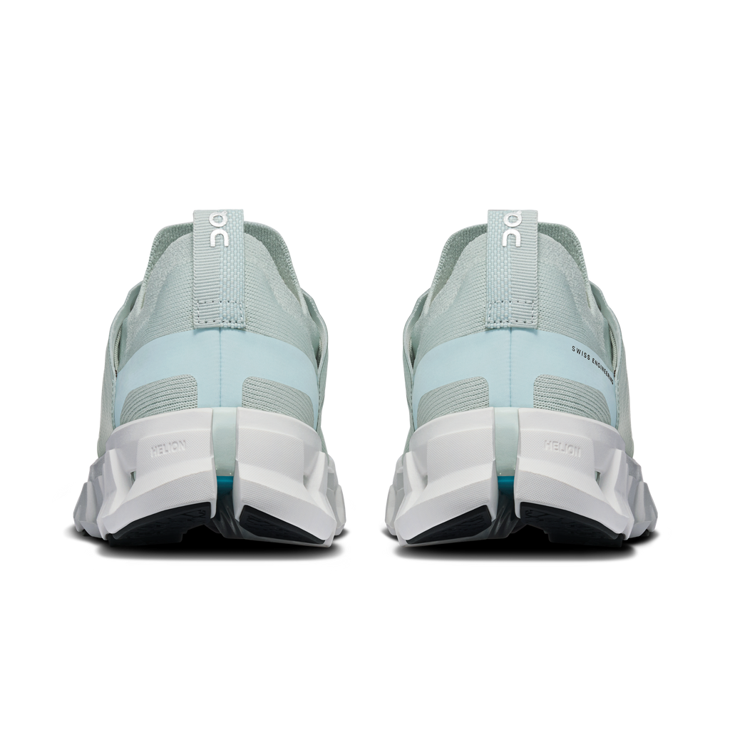 Back view of light blue lace-up running shoes with white heel counter