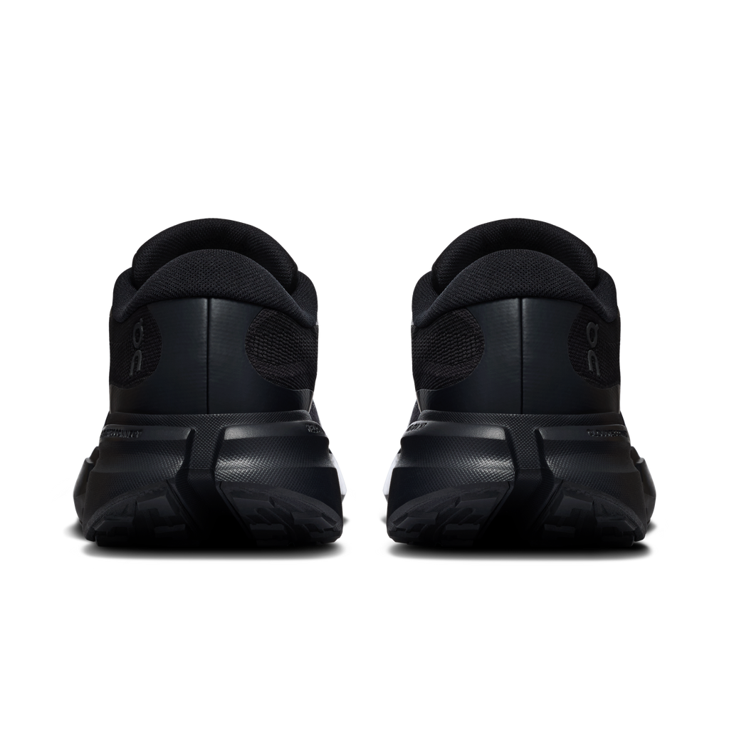 On Cloudsoma Hike men's black trail shoes, rear view with heel pull tab and tread