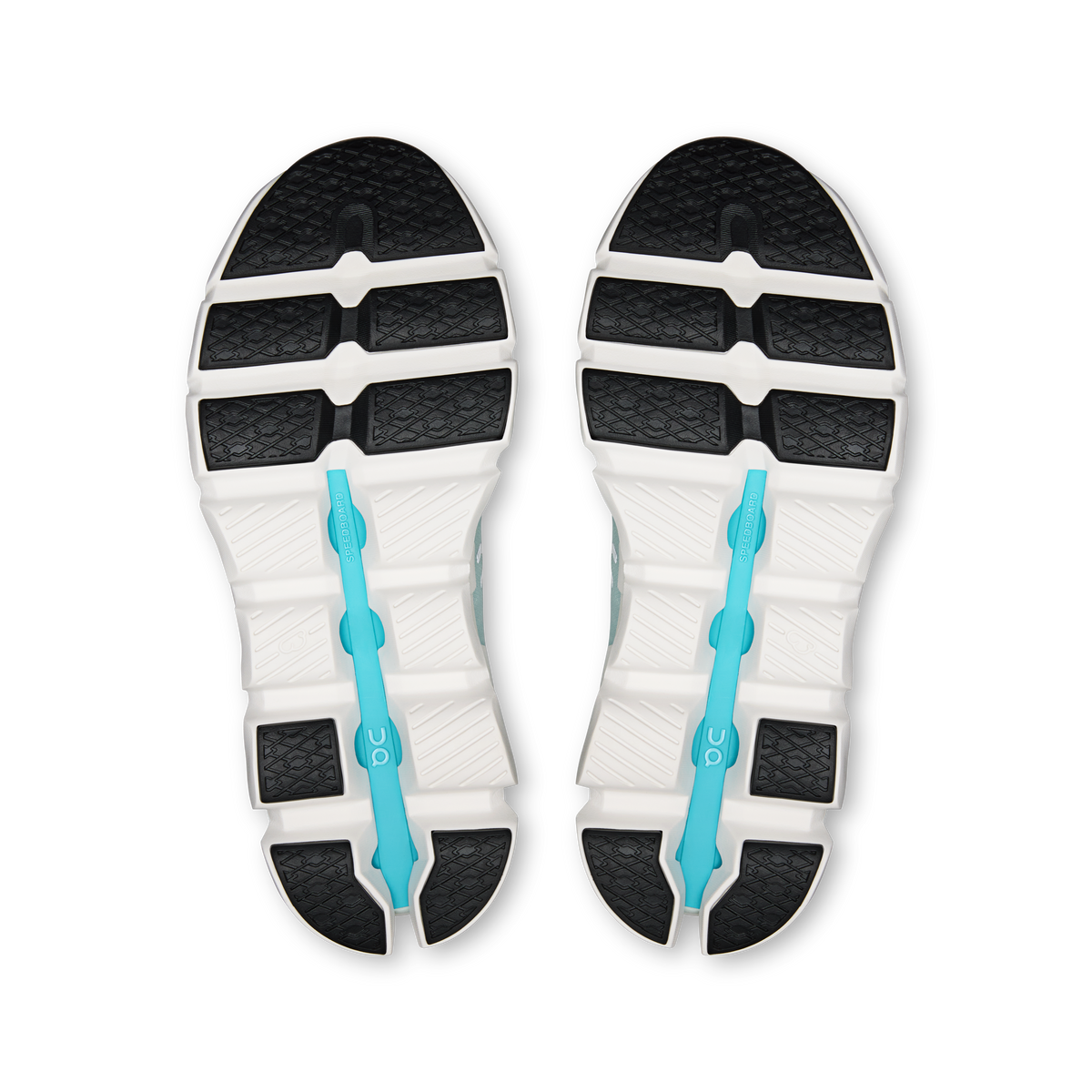 Shoe outsoles with black traction pattern, white midsole, and turquoise support fin