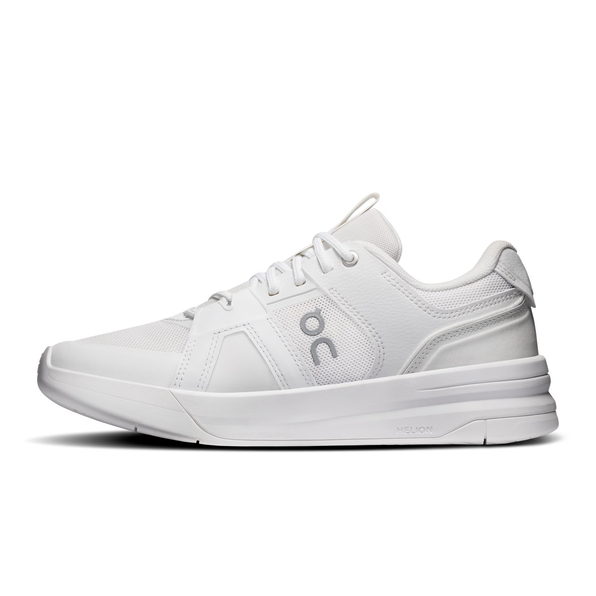 On women's running shoes in white with lace-up design and side logo near toe