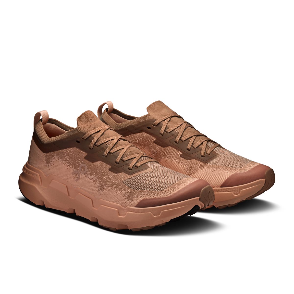 On men's running shoes, side view, tan-brown upper with lace-up closure