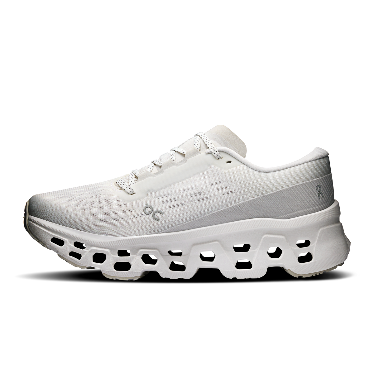 Women's white running shoes with OC branding, lace-up mesh and cloud pod outsole