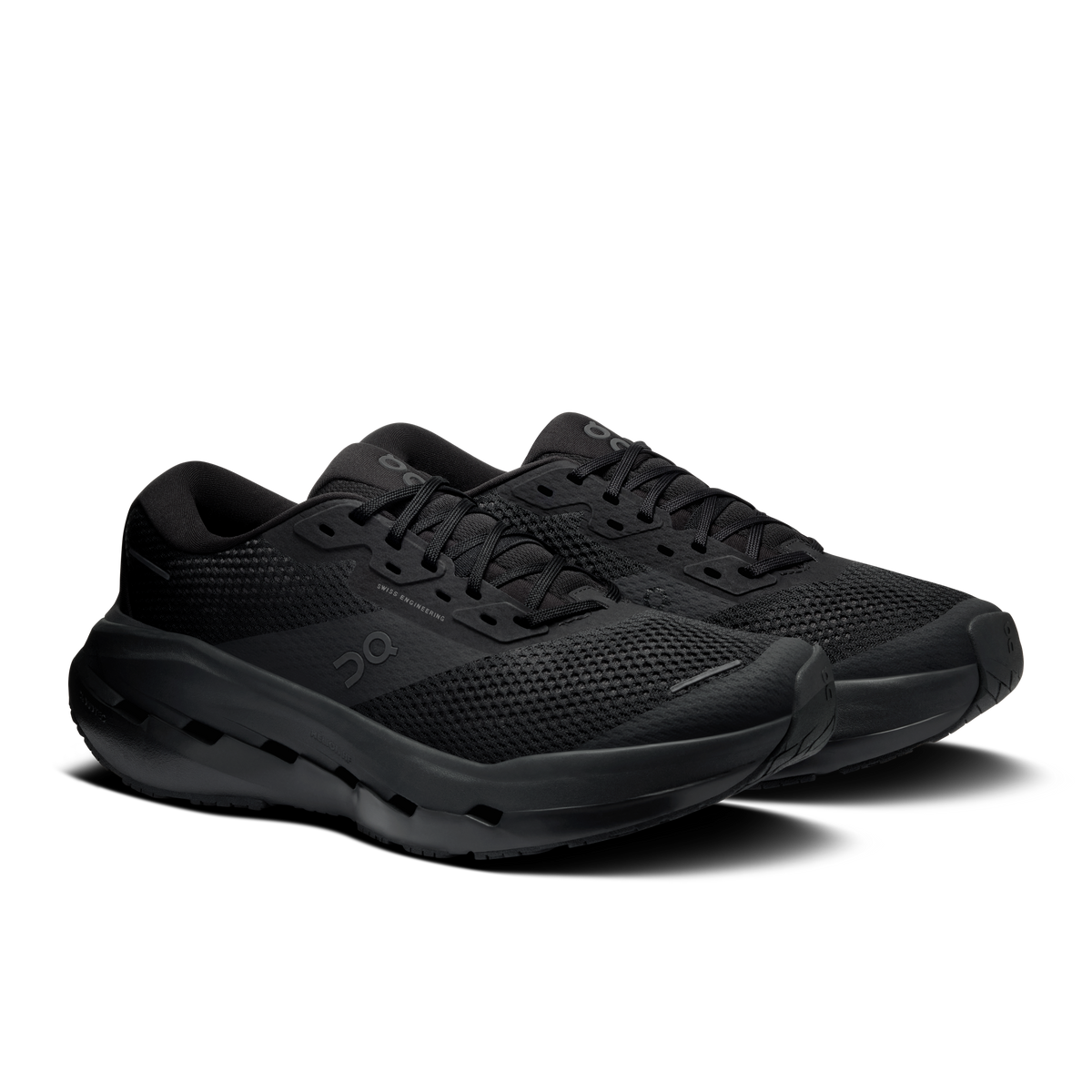Men's black running shoes, side view showing molded tread sole and lace-up upper