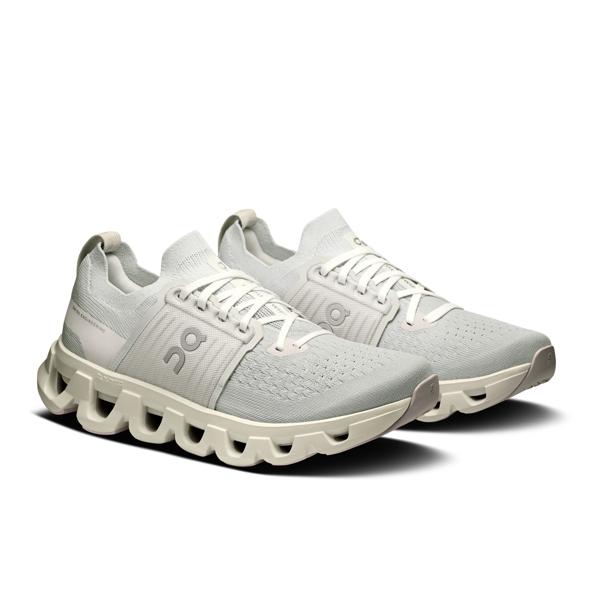 Women’s running shoes, light gray knit upper with white lace-up and CloudTec pods