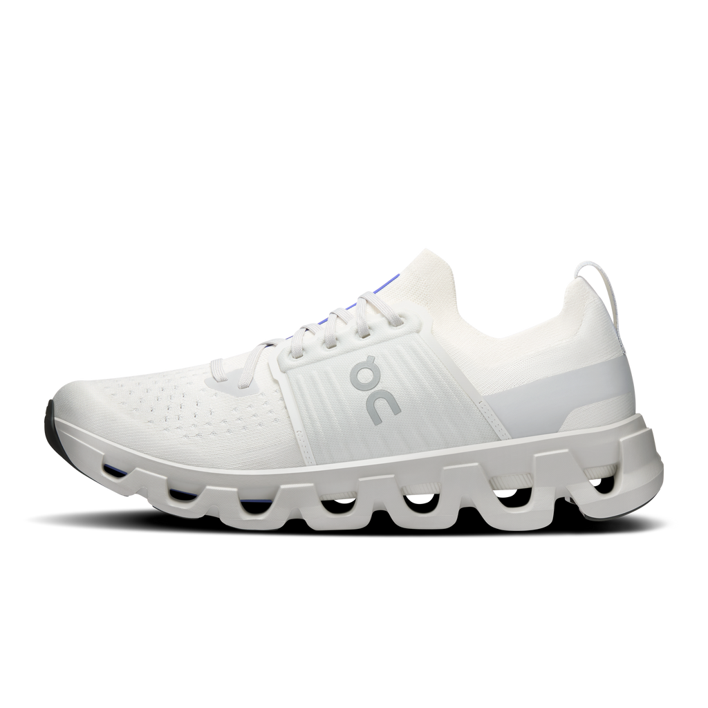 Ivory running shoe side view with lace-up upper and CloudTec cushioning pods