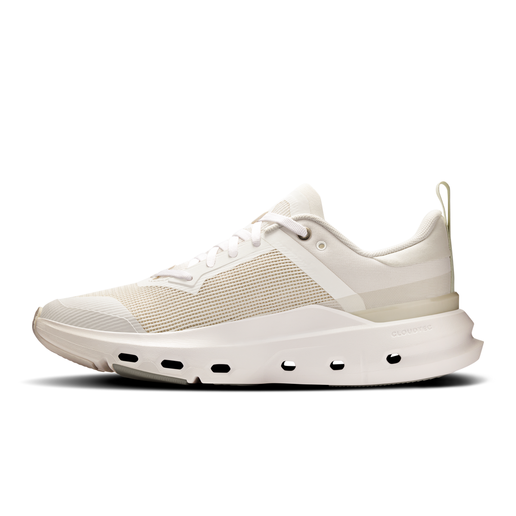 Women’s white running shoe with lace-up upper, side stripe, and CloudTec midsole