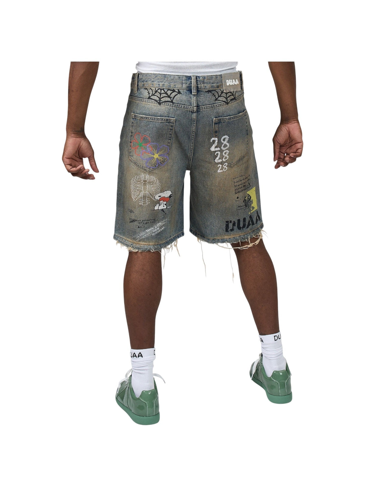 Men's blue denim shorts with colorful art patches, frayed hem and button closure