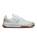 On women's white and ivory low-top lace-up sneakers with logo on side